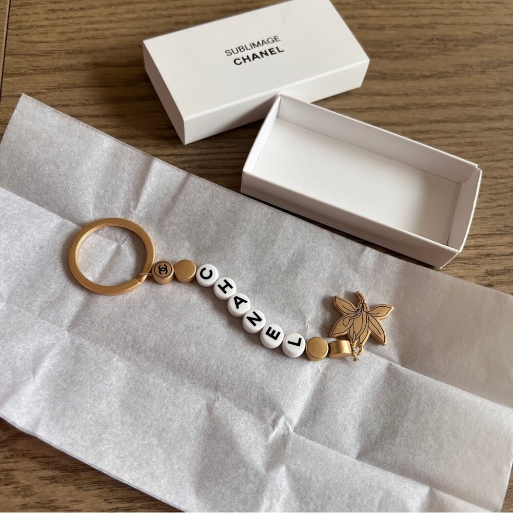 CHANEL Sublimage Orchid Keychain